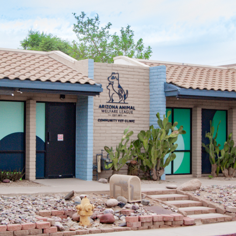 Arizona Animal Welfare League Community Vet Clinic building with a dog logo and desert landscaping.