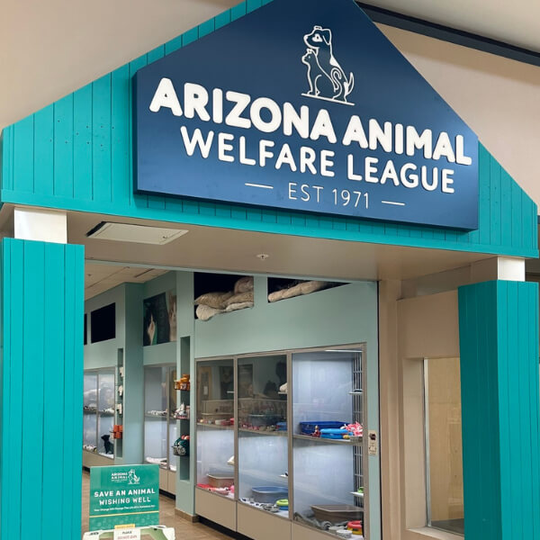 The Arizona Animal Welfare League storefront at Chandler Fashion Center with its teal entrance and sign